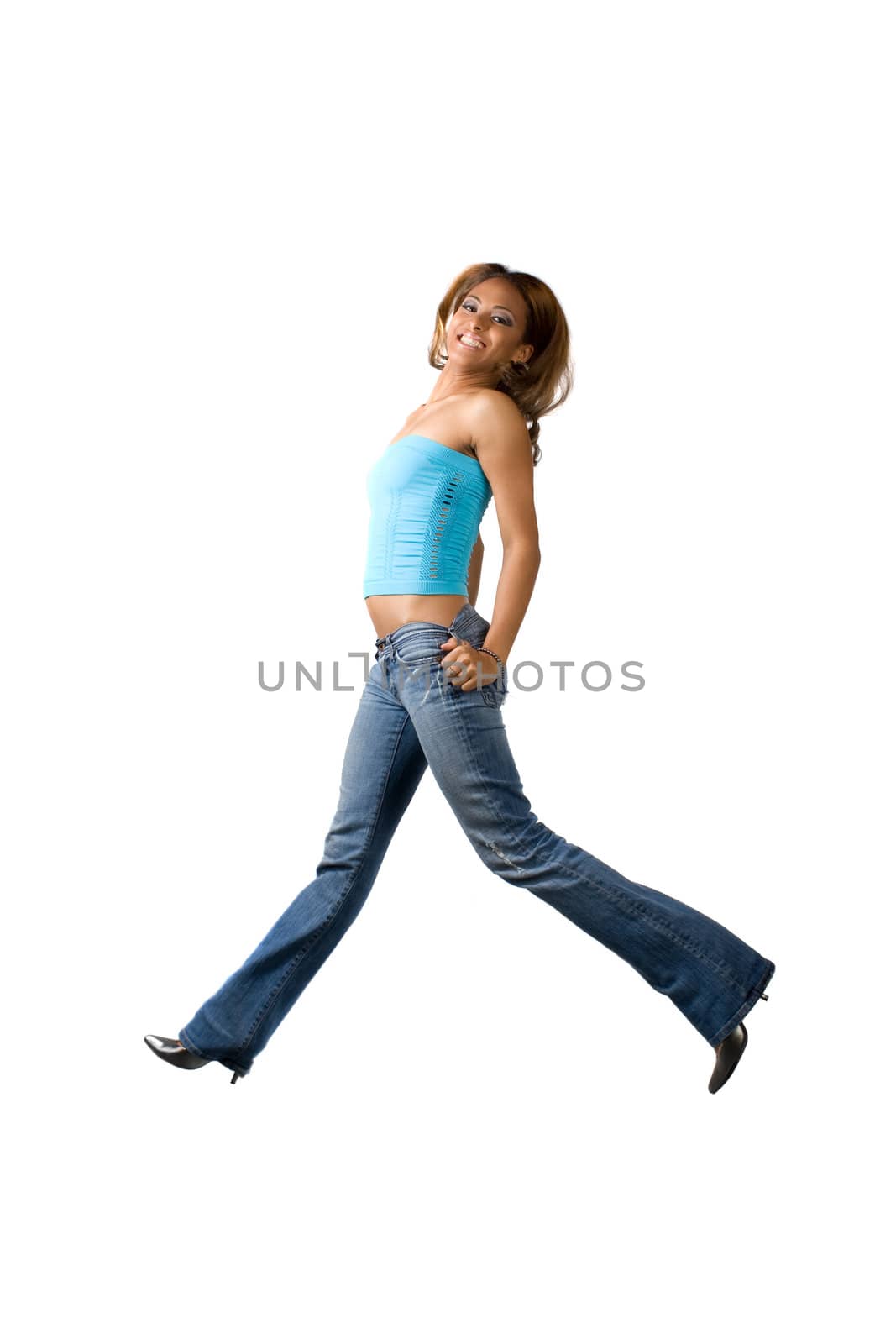 A young woman jumping on a white background.