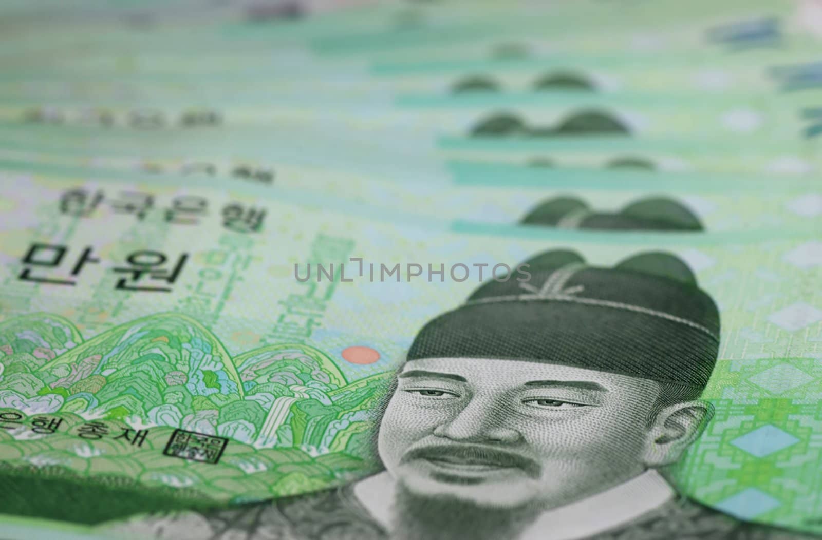 A close-up of several Korean 10,000 Won banknotes
