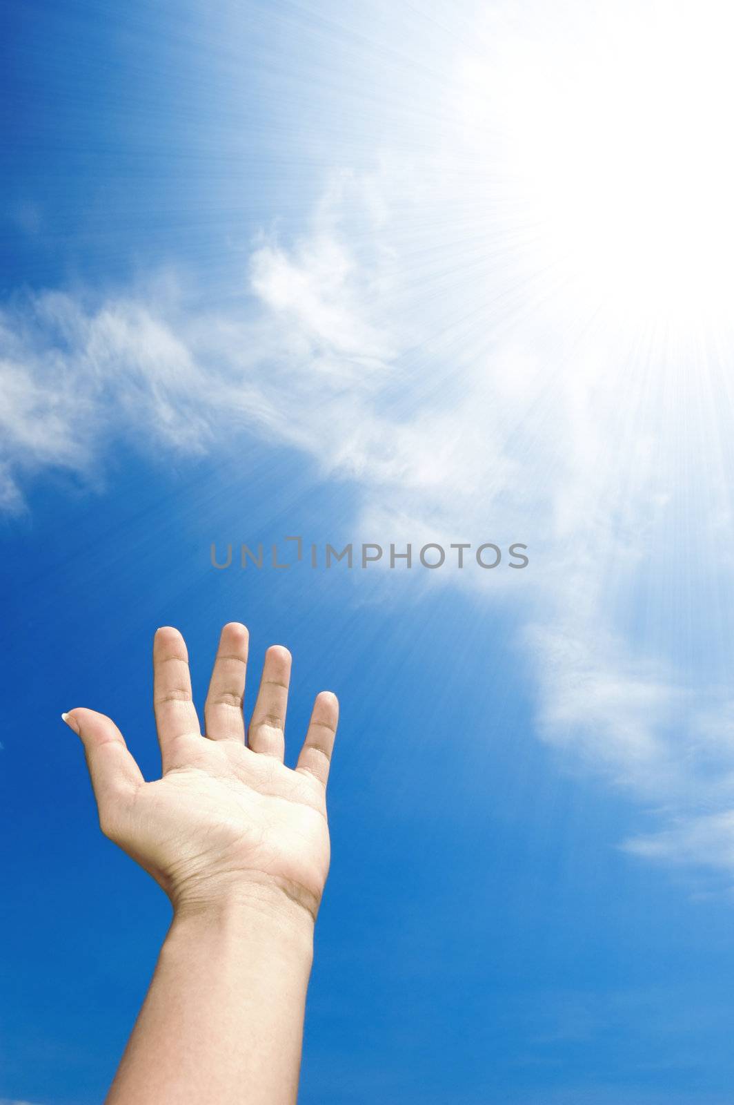 abstract concept hand towards sky, ray of light 