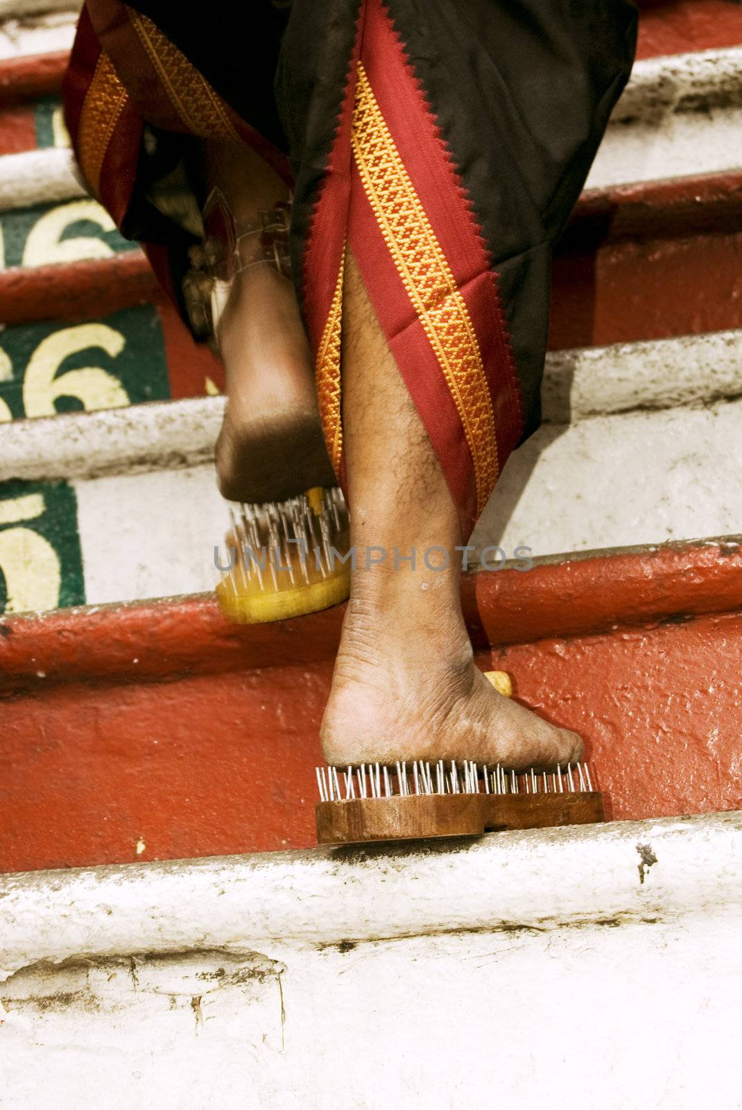 Close up of a devotee's leg at Thaipusam event celebrating Lord Murugan 