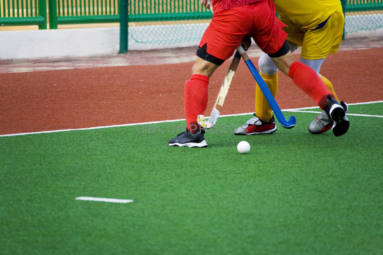 Image of men's field hockey players in action. 