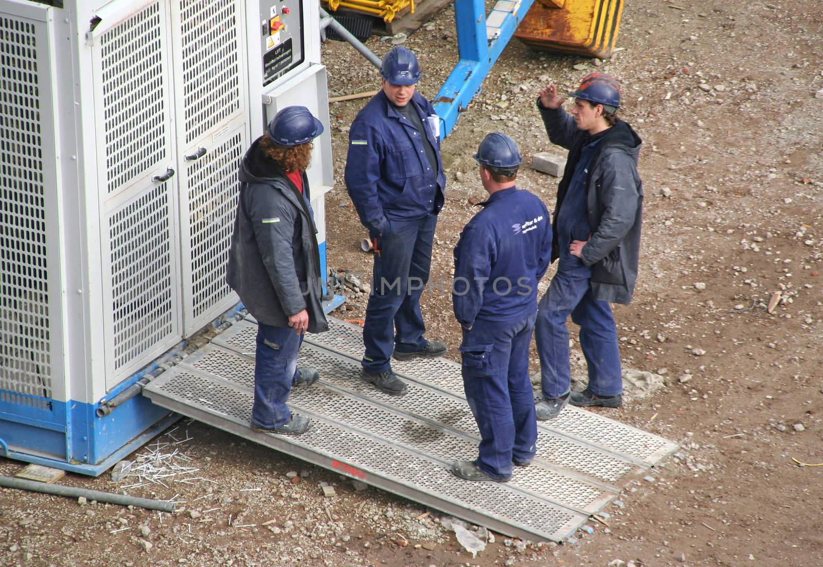 Construction Workers waiting for an elevator