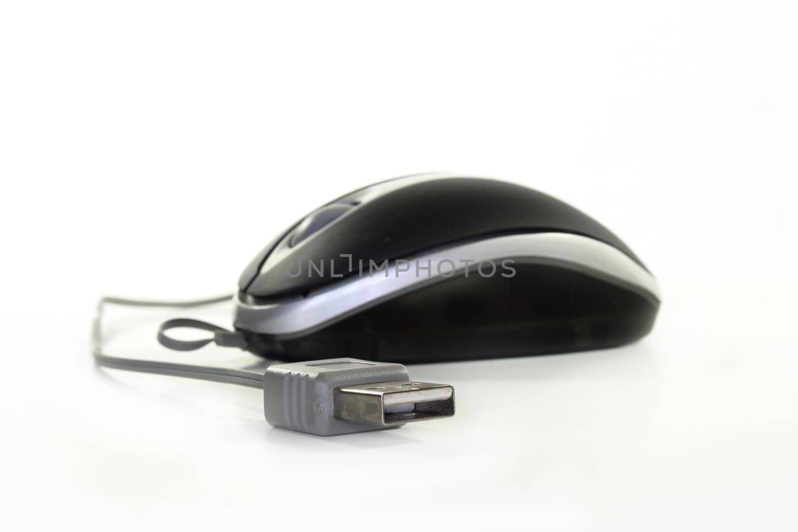 Computer mouse with cable on white background