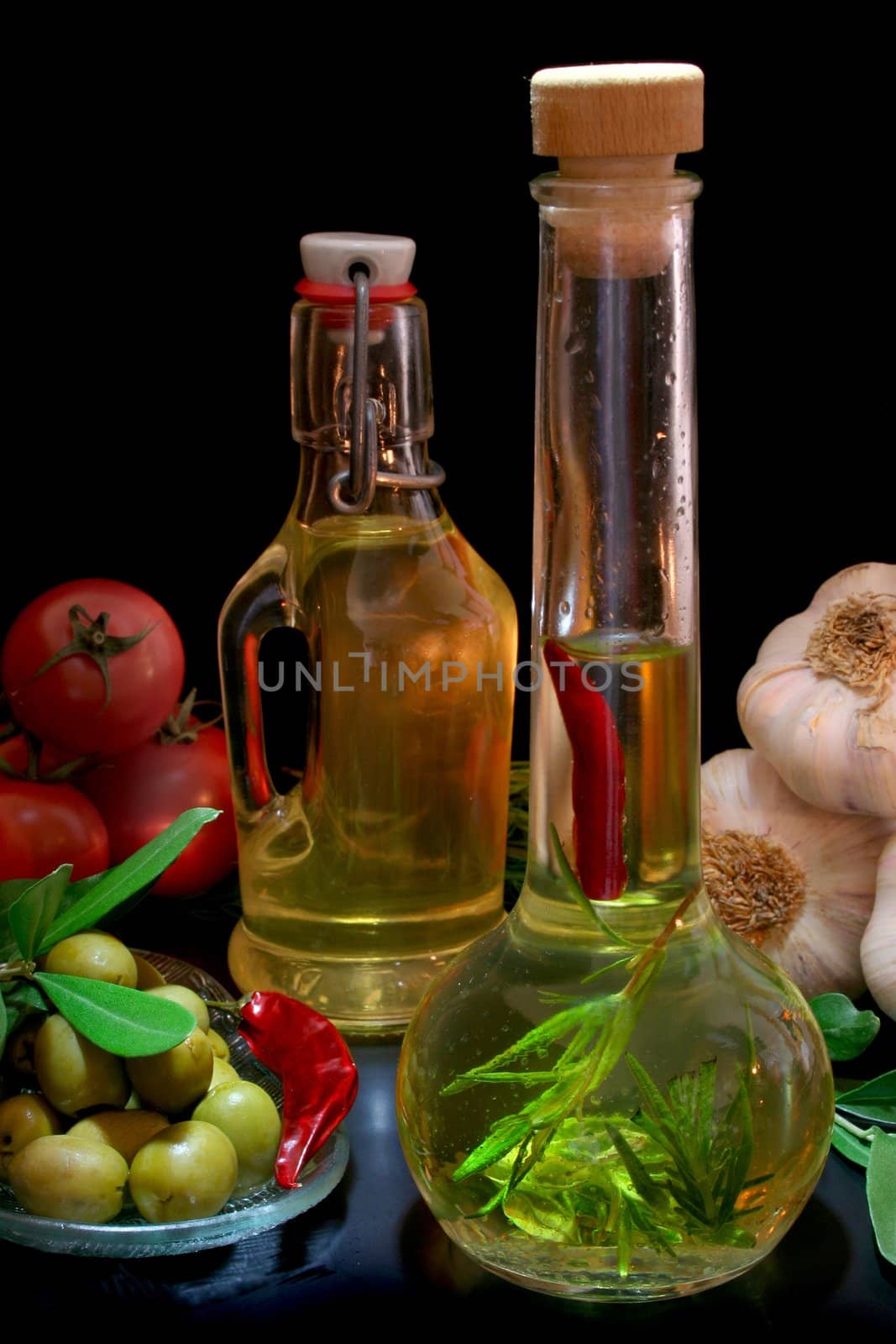 Herbal Oil with olive branch and fresh ingredients