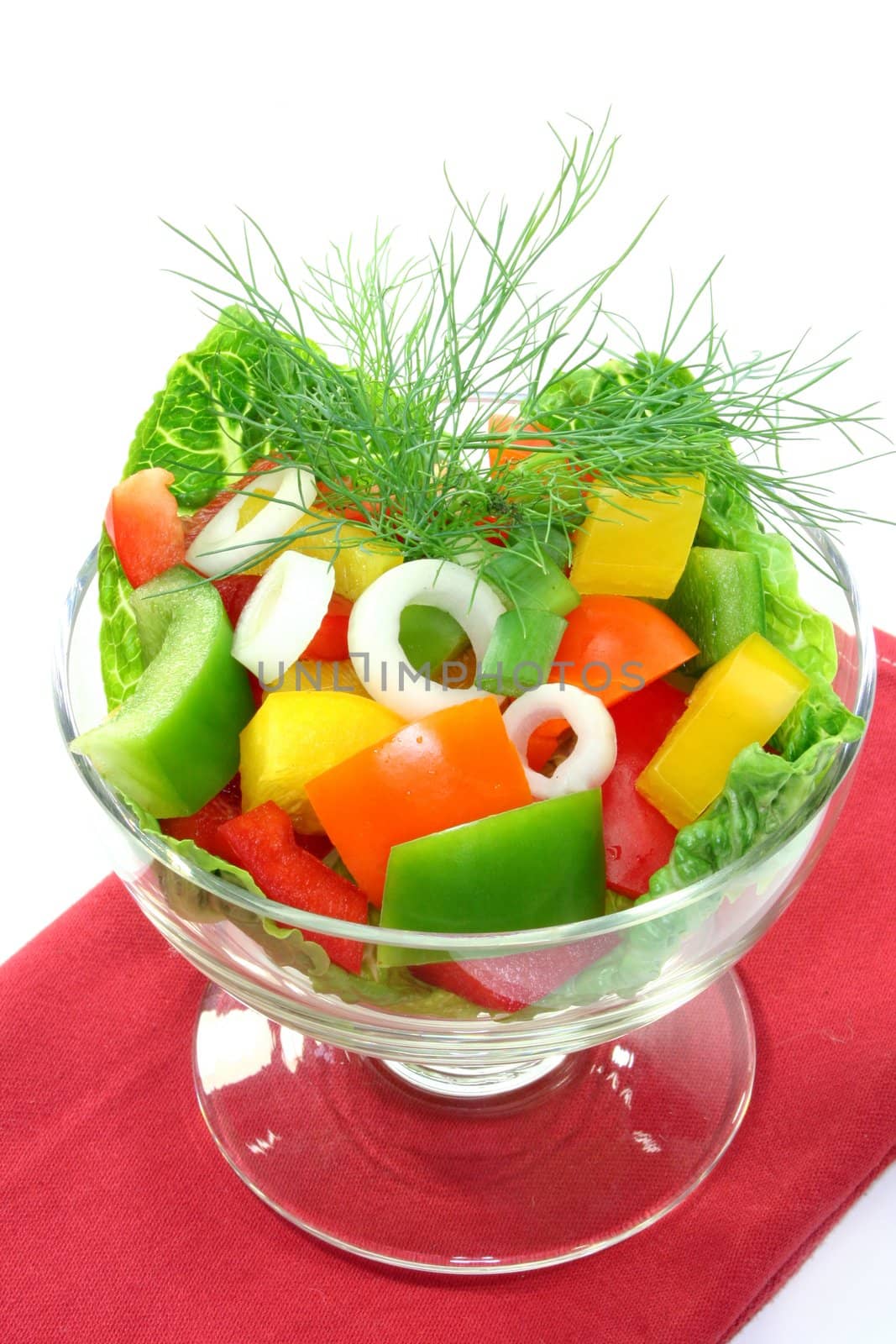 colorful bell pepper salad with dill in small glass bowl