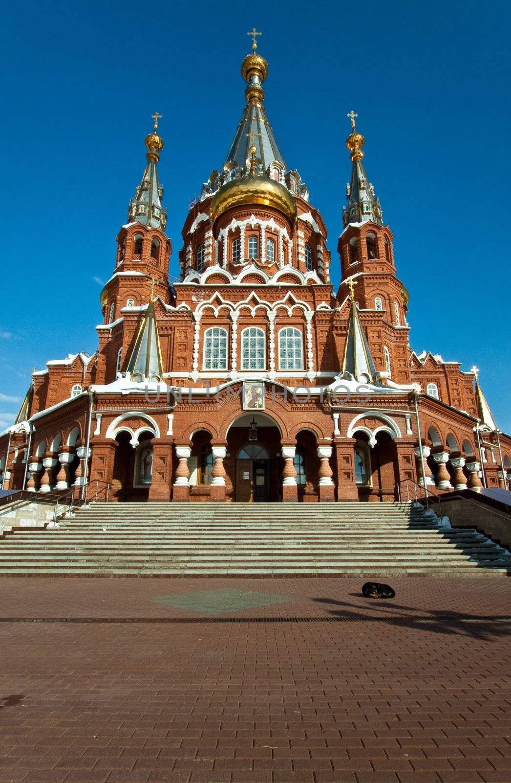 Picture is very beautiful building, on a background of sky and clouds