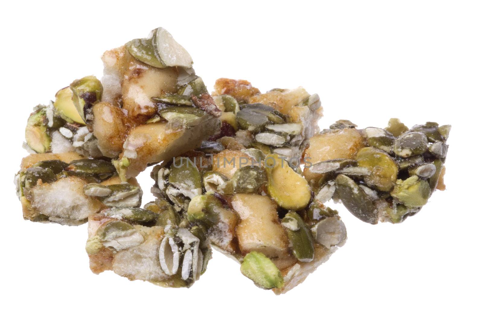 Isolated macro image of crunchy pumpkin and pistachio bites.