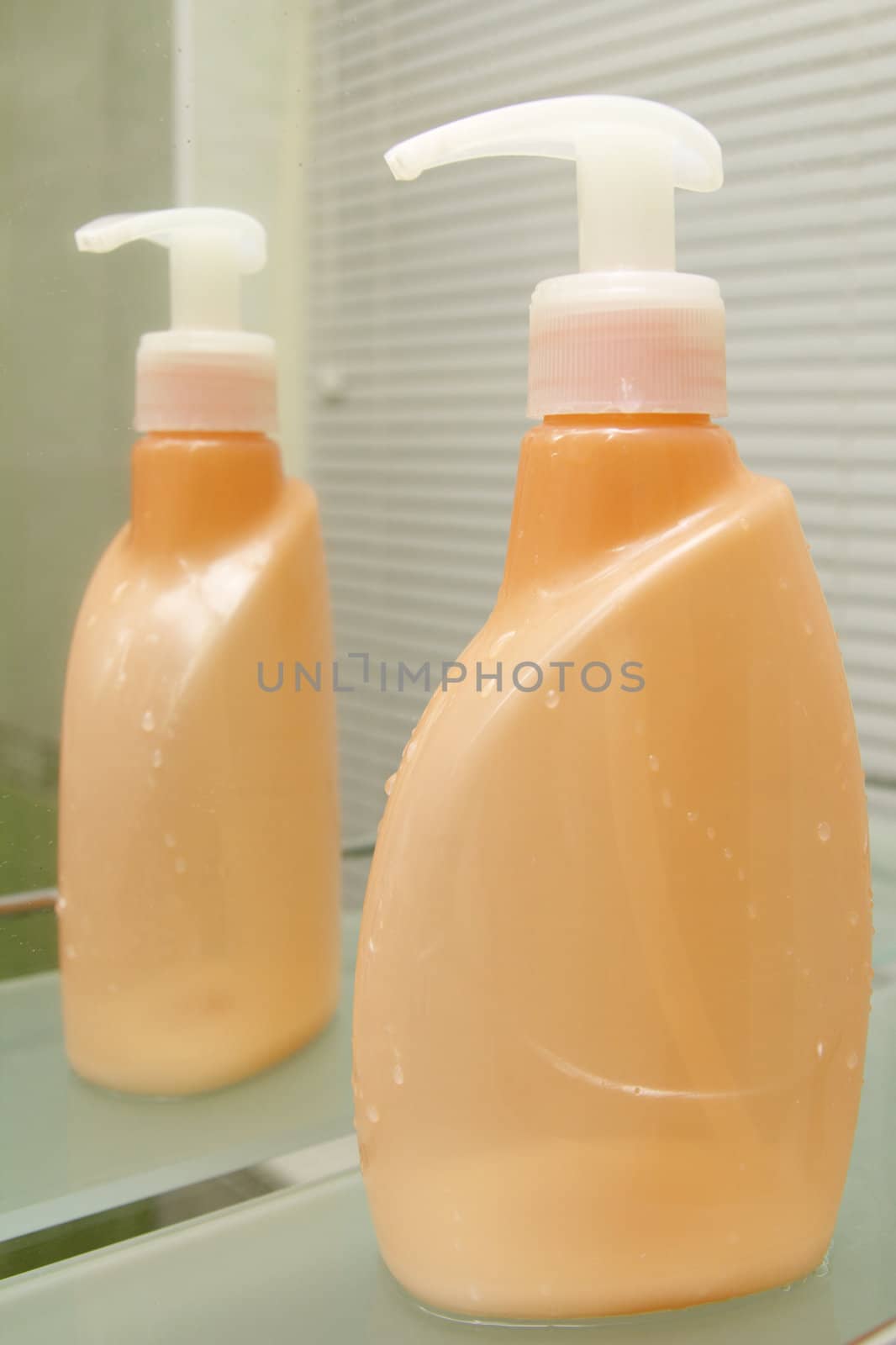 orange bottle for hygiene by alkorphoto