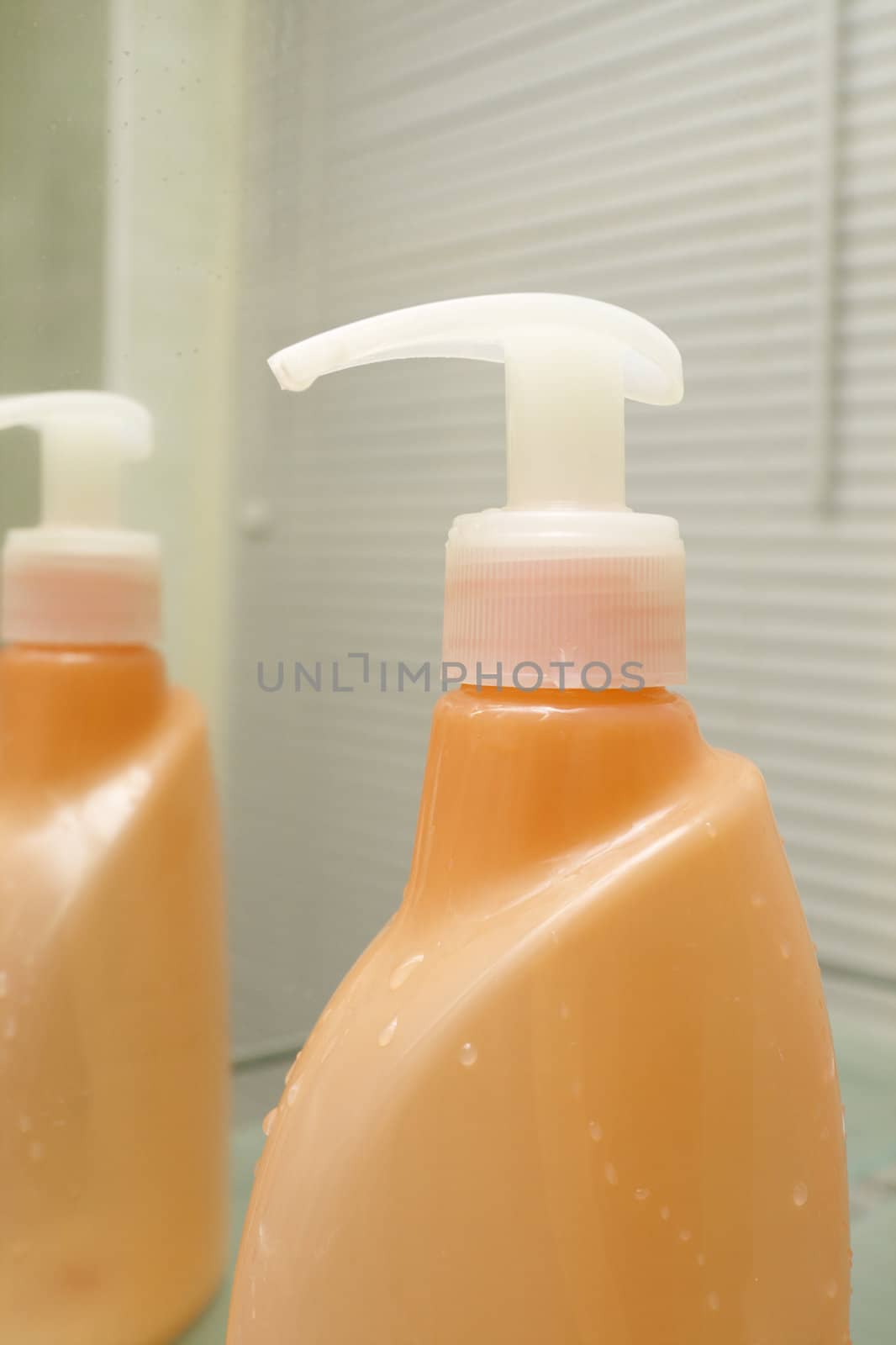orange bottle for hygiene by alkorphoto