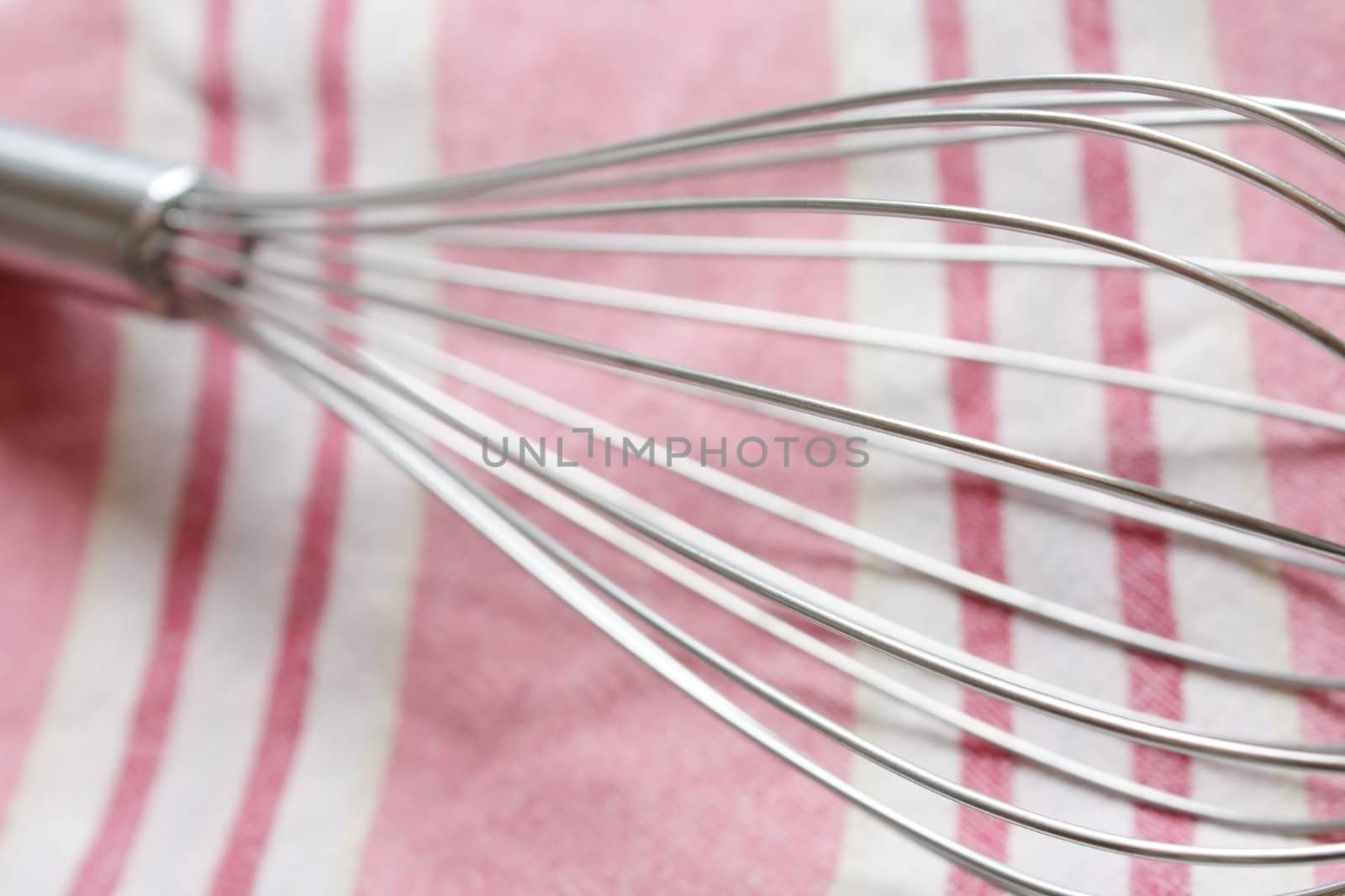 A whisk in a horizontal composition