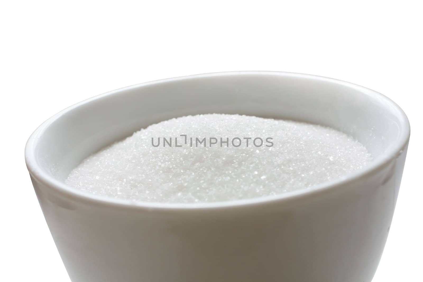 Sugar in a bowl isolated on white