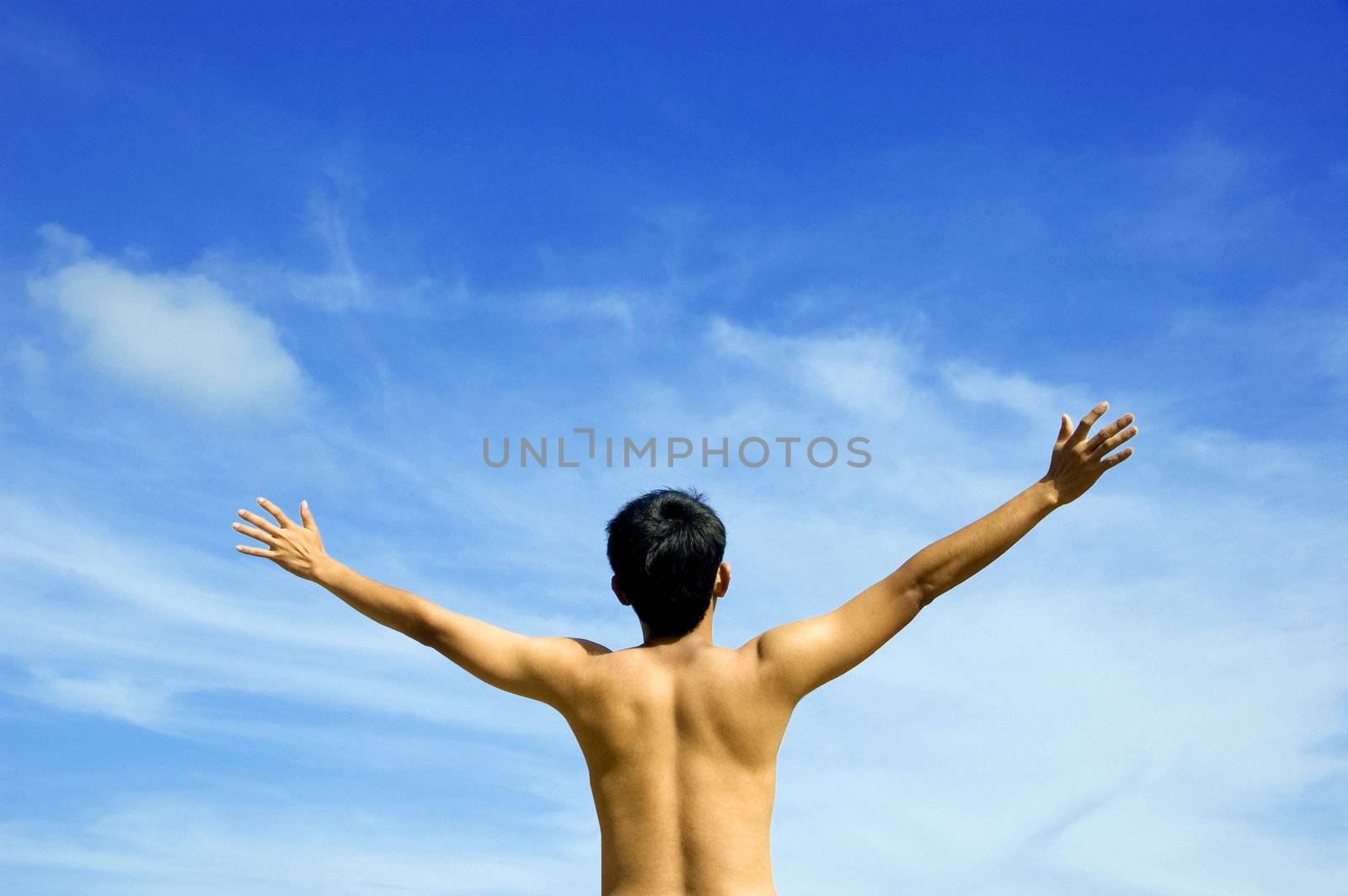 Man with his arms wide open
