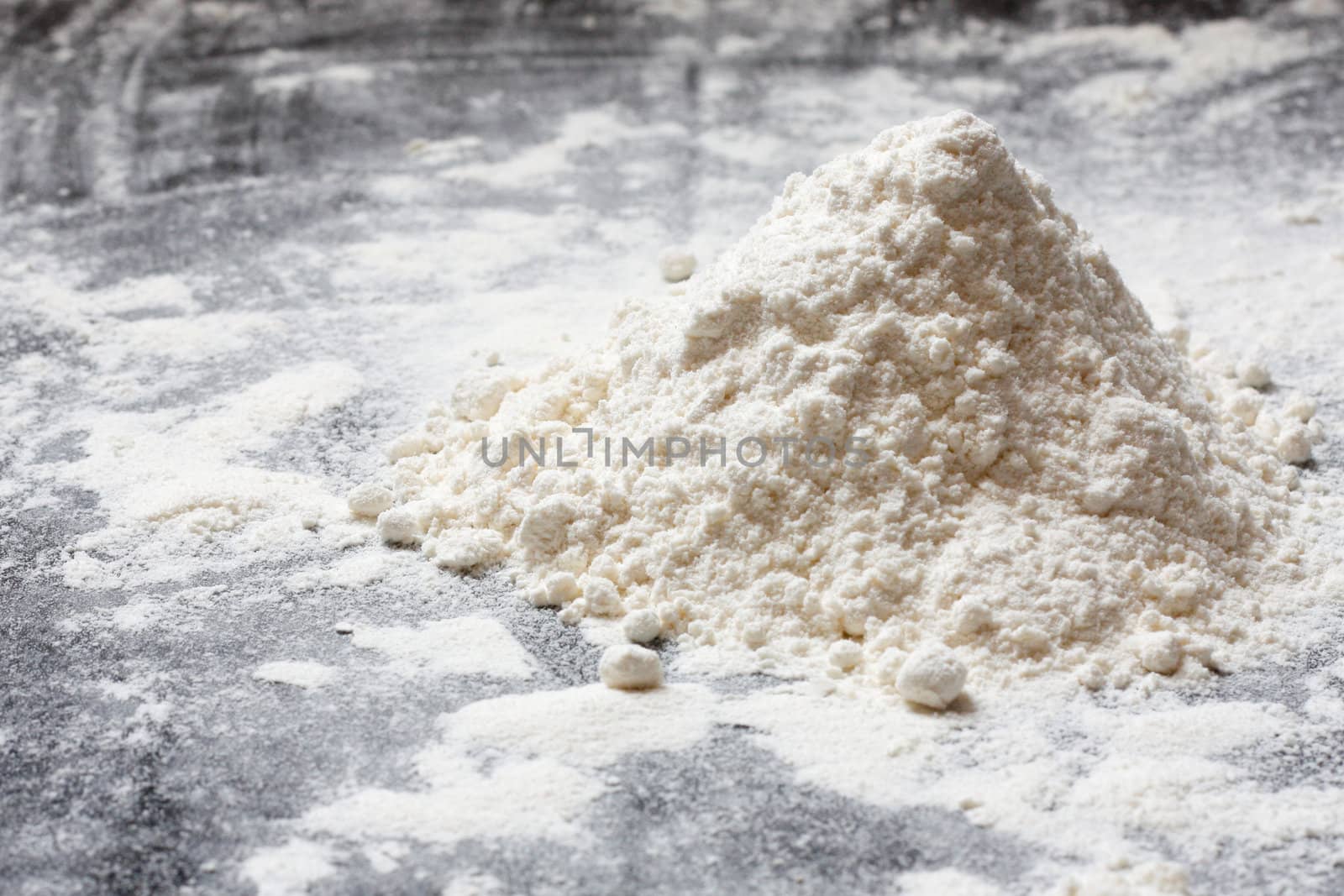 Flour in a heap on a kitchen top