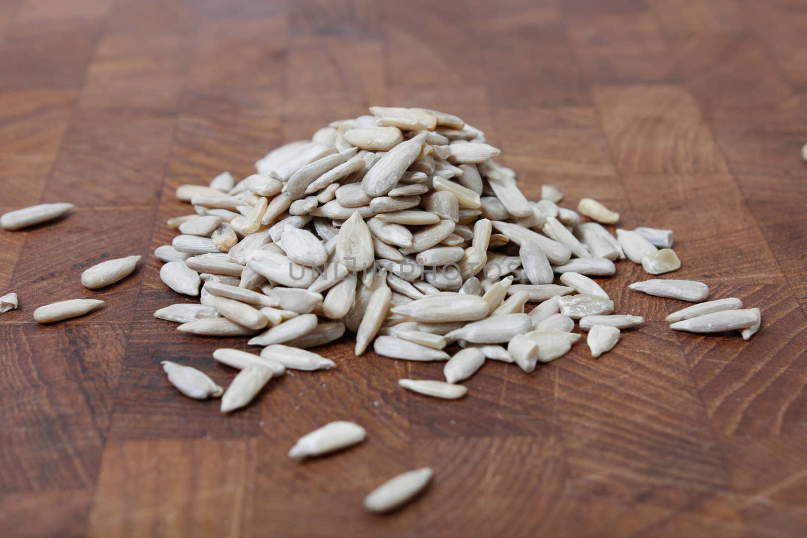 Healthy sun flower seeds on a wooden bg