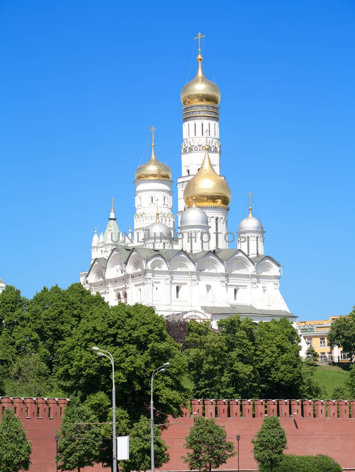 Golden dome in Moscow Kremlin over blue sky