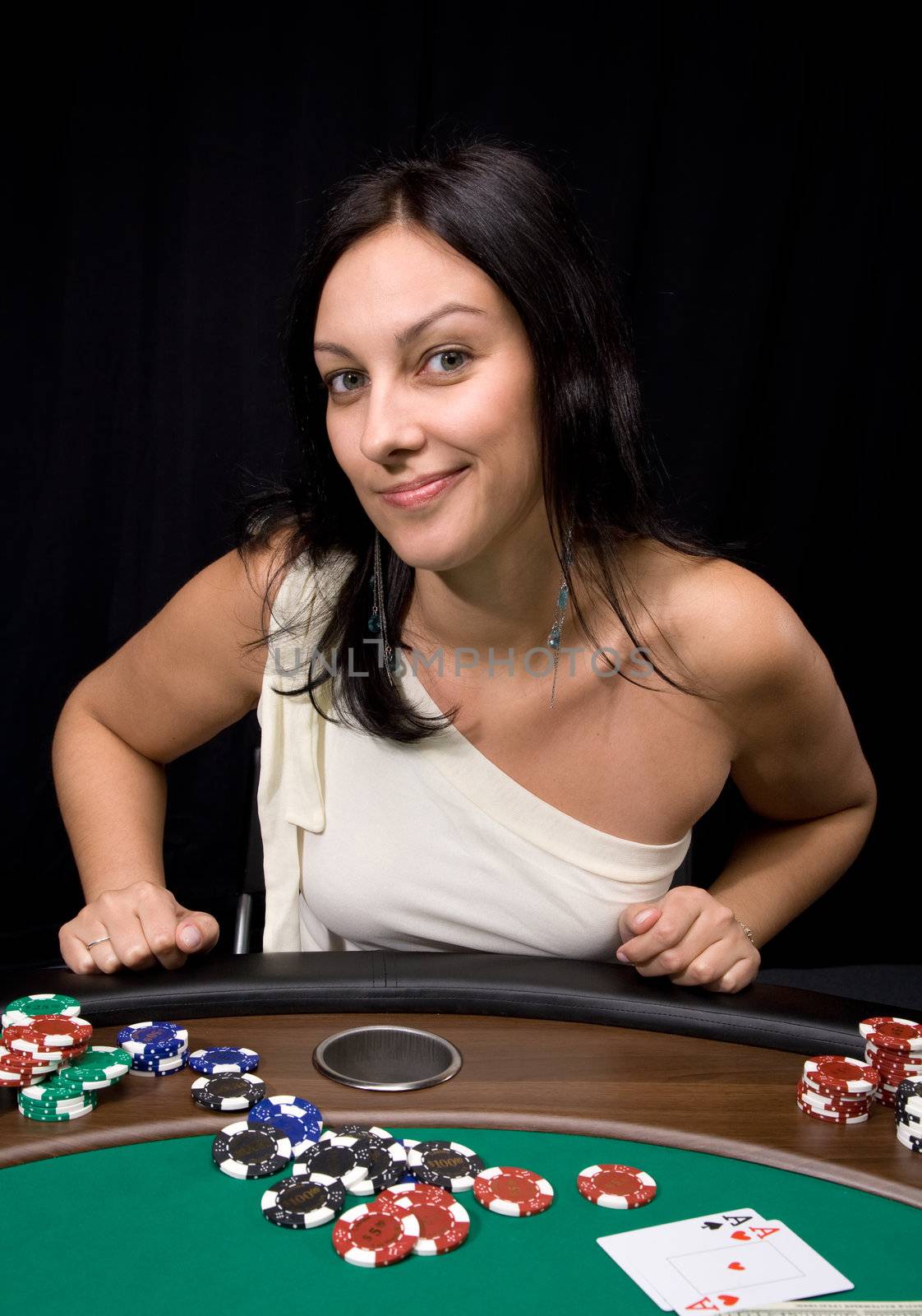 Pretty caucasian girl shows two aces in casino poker and win!
