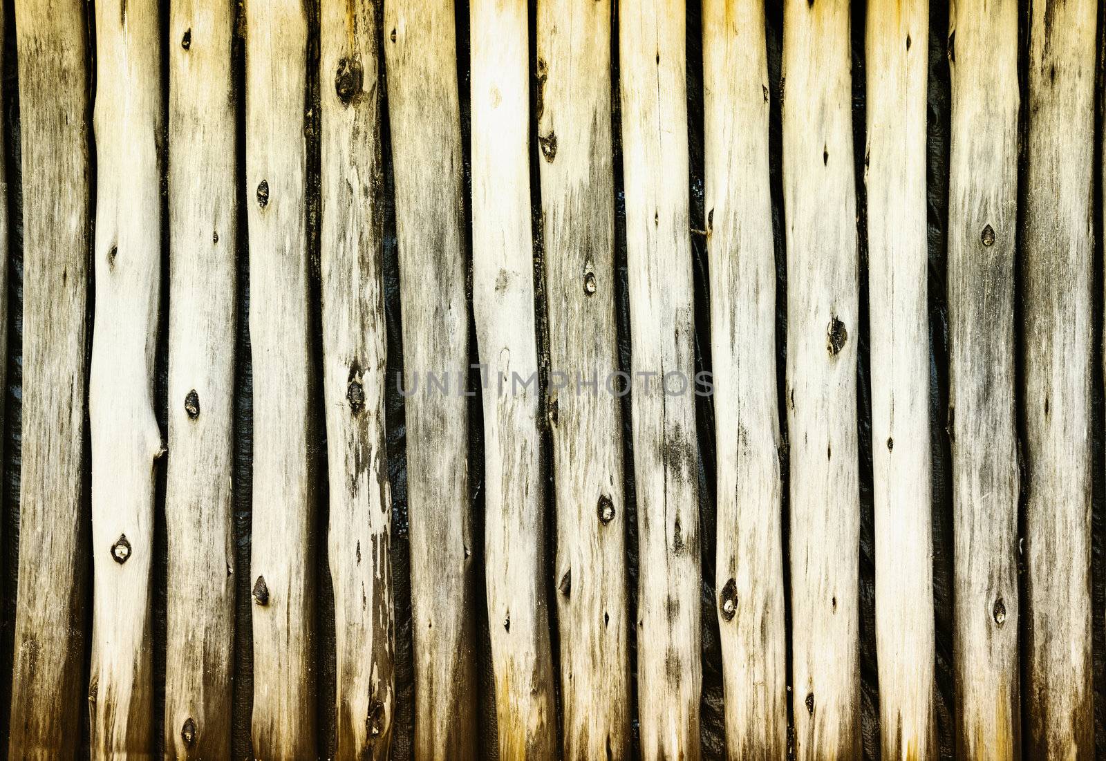 Dilapidated old wooden fence - a rural grunge background
