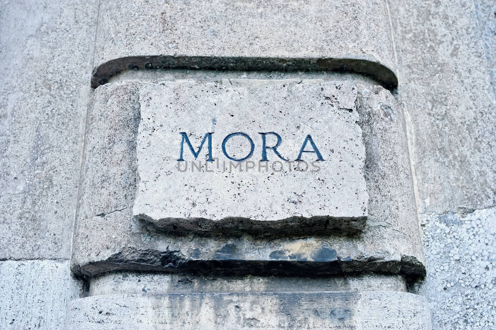 Inscription on a stone wall in Rome, Italy