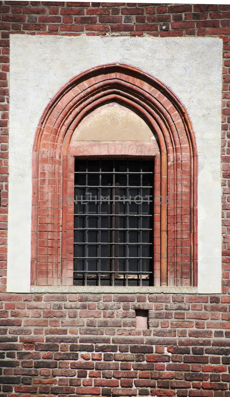 Details on roman window in Milan, Italy