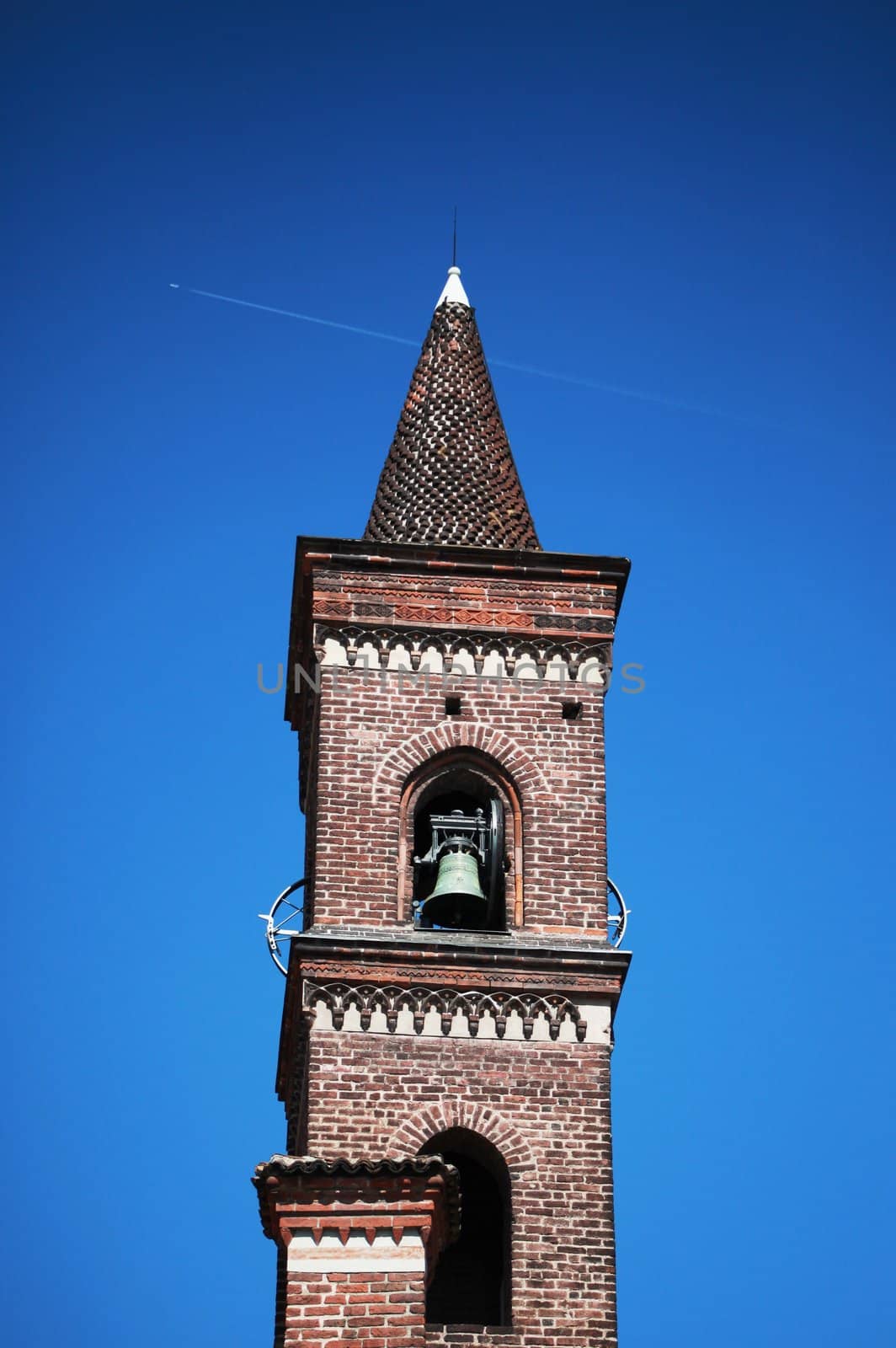 Bell tower on blue sky background