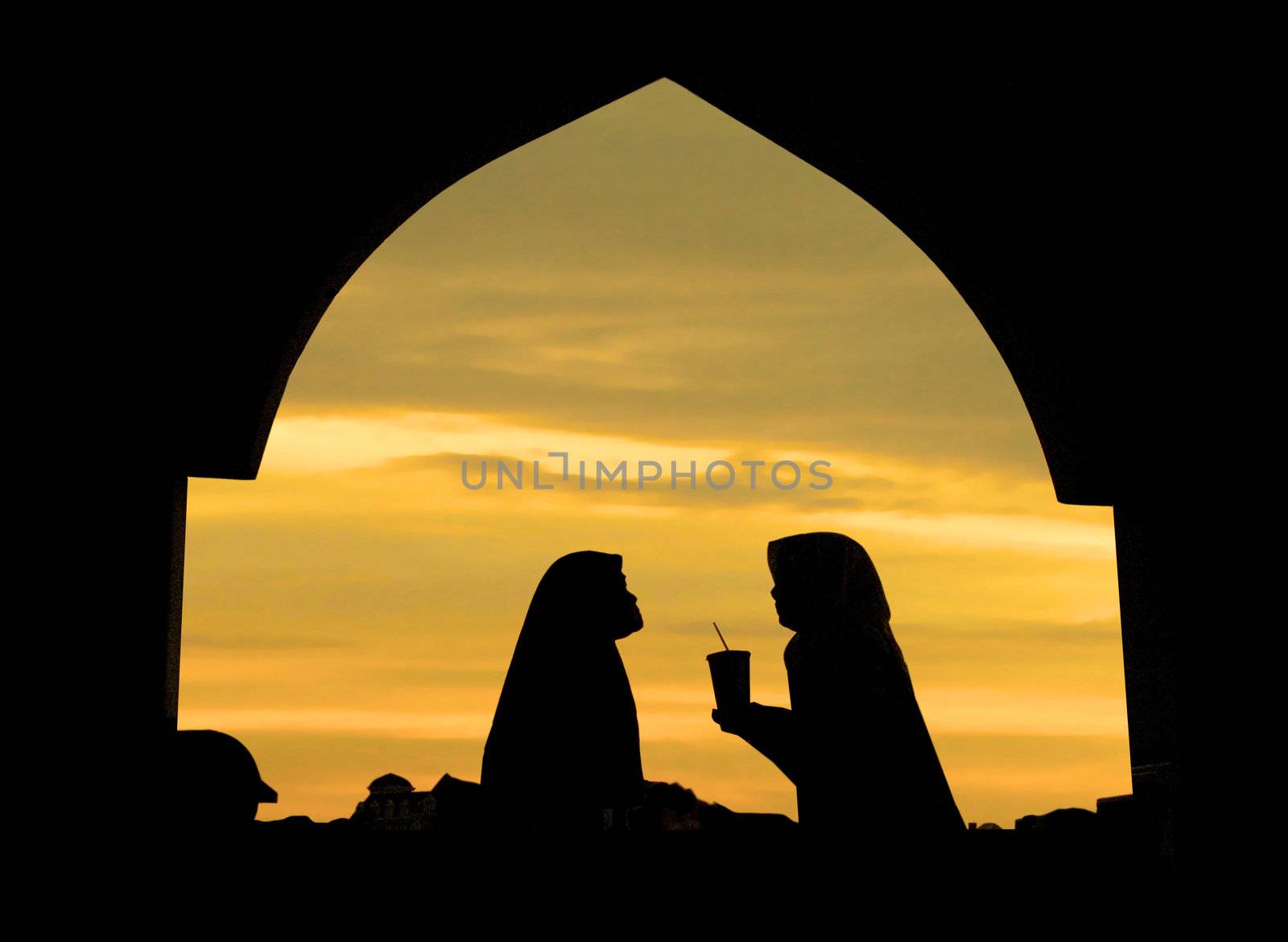 Islamic woman infront a mosque 
