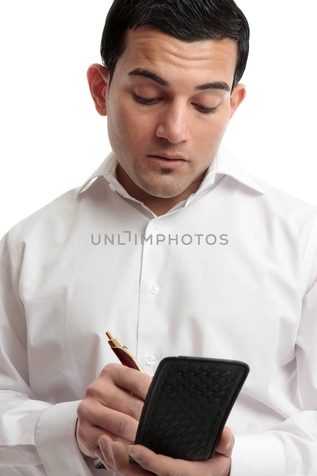 A businessman or waiter writing in a notepad