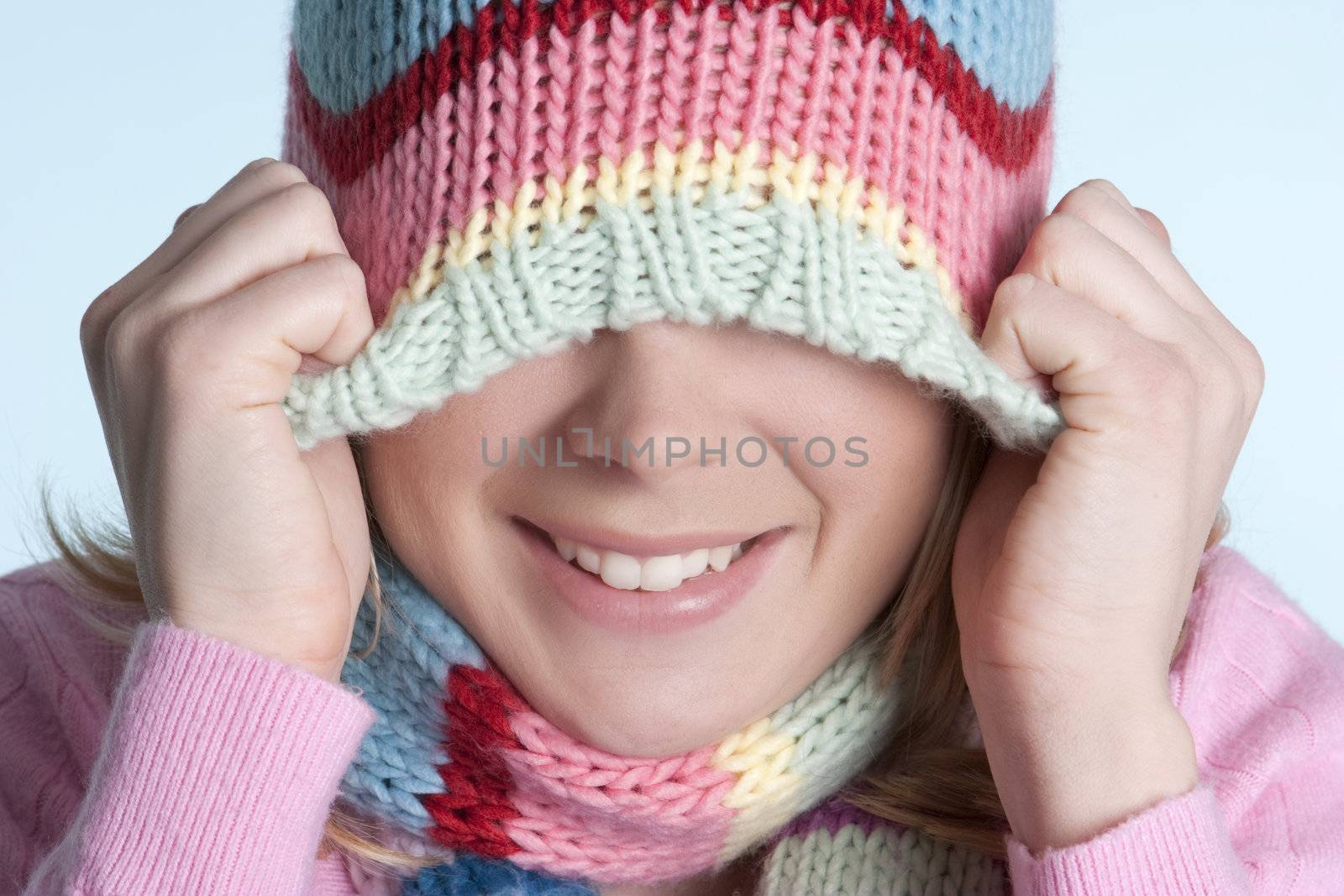 Playful winter beanie hat girl