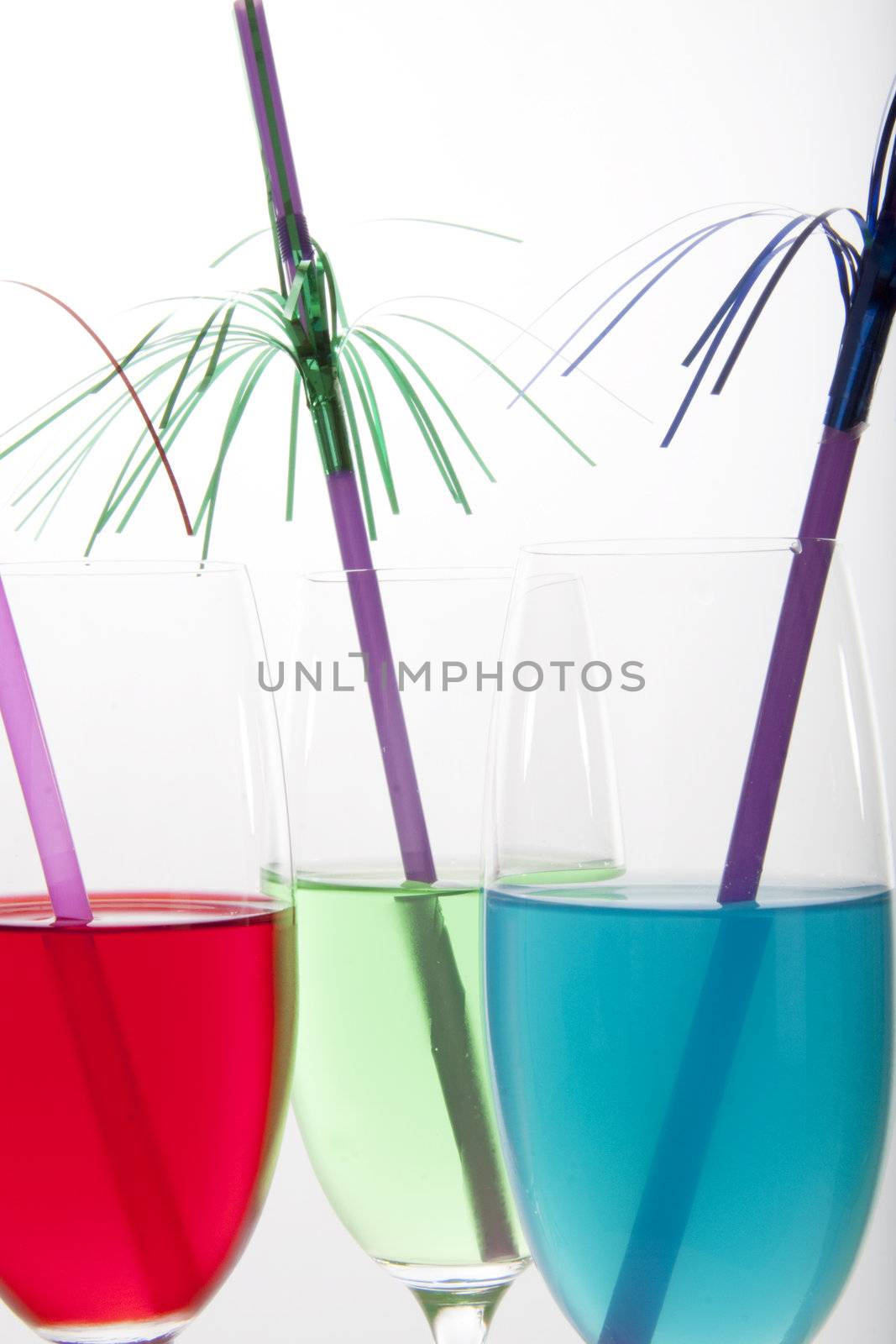 Colorful cocktails in red, green and blue with festive decoration