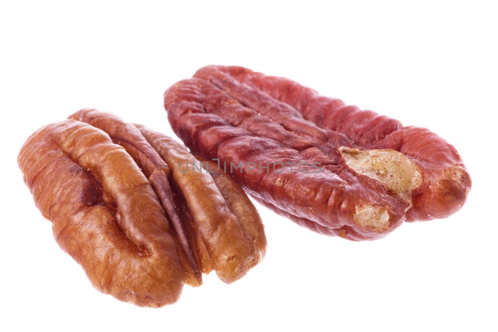 Isolated macro image of pecan nuts.