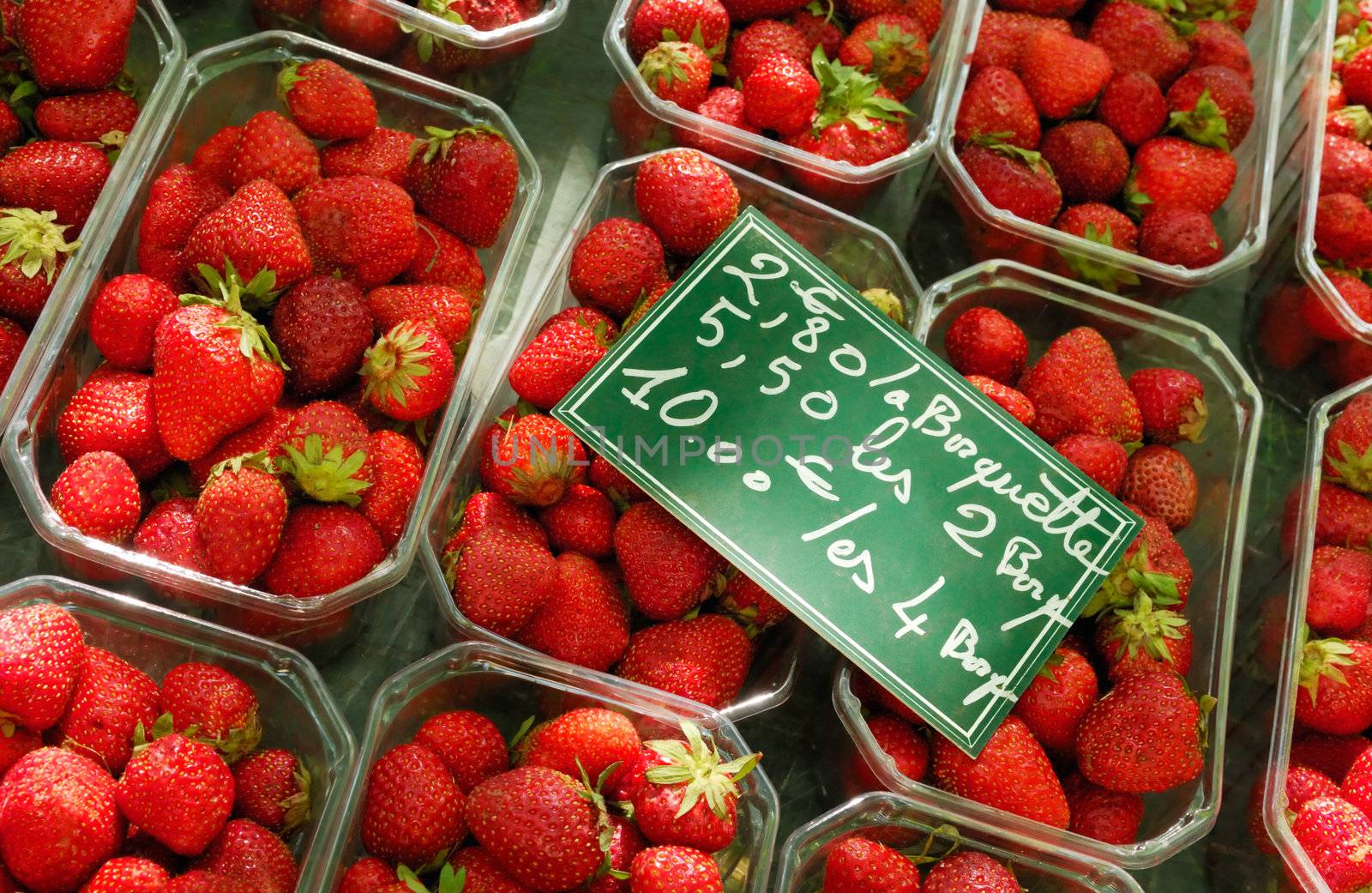 Image shows a strawberry stand in France