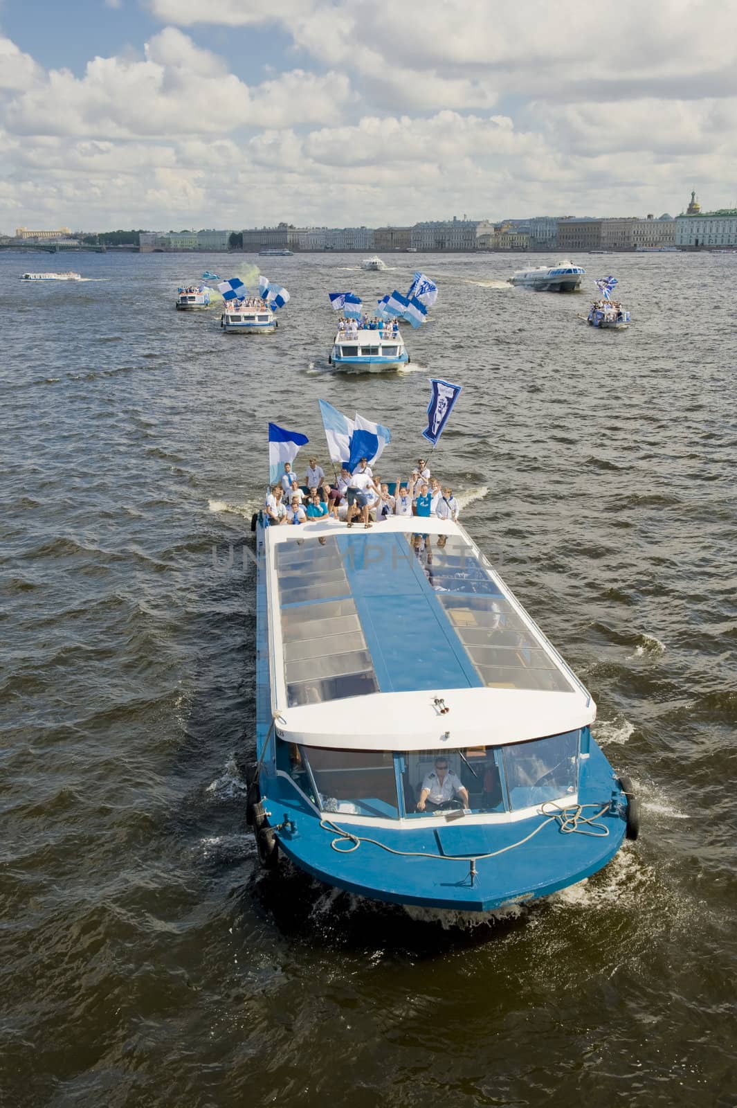 Football fans celebrate a victory of football club ZENITH by boats down the river Neva in St.-Petersburg, Russia 
