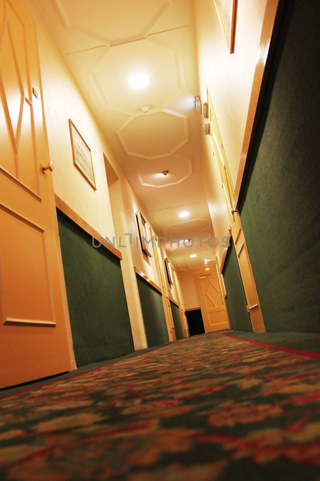 hotel corridor with lamps on the ceiling