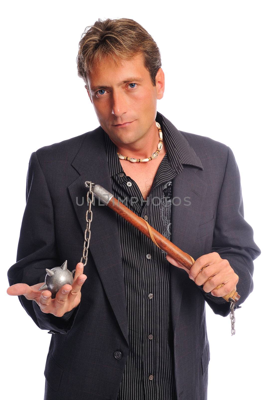 a business man holding a ball and chain ready to crush his competition