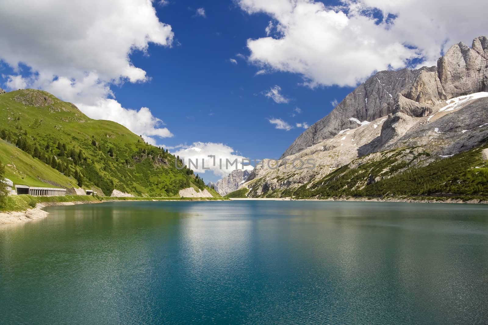 The artificial lake and pass of Fedaia (Dolomites, Trentino, Italy), at summer
