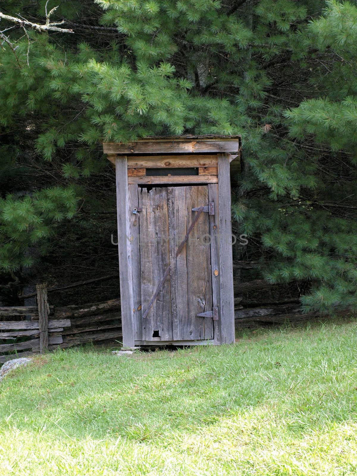 Old wooden outhouse on a rural farm