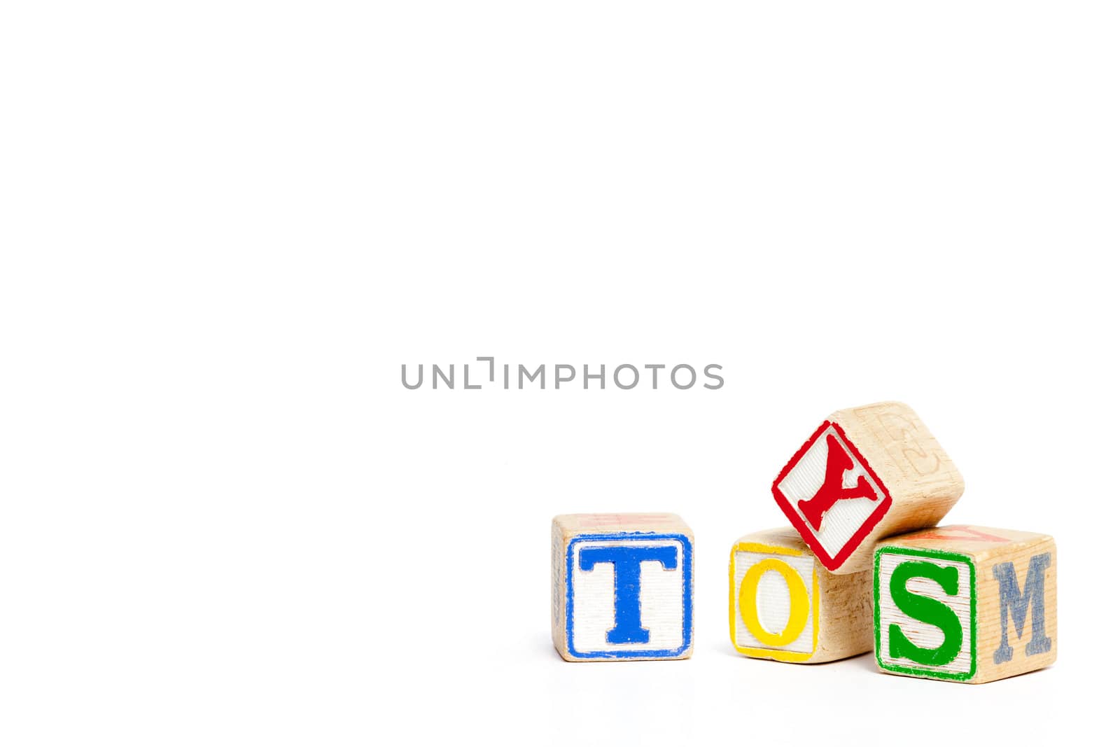 Toy blocks isolated on white spelling the word toys