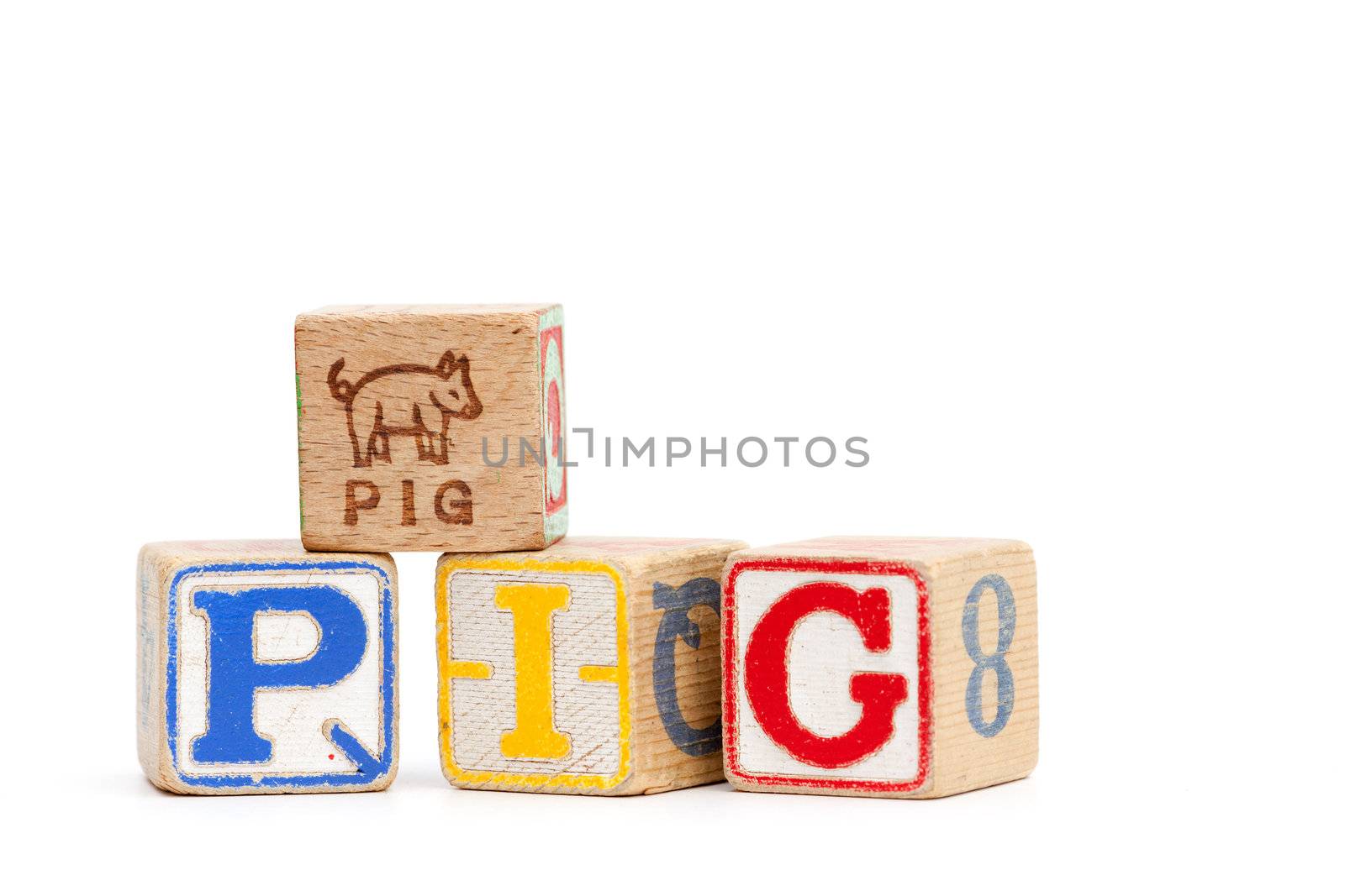 The word pig spelled with childrens blocks