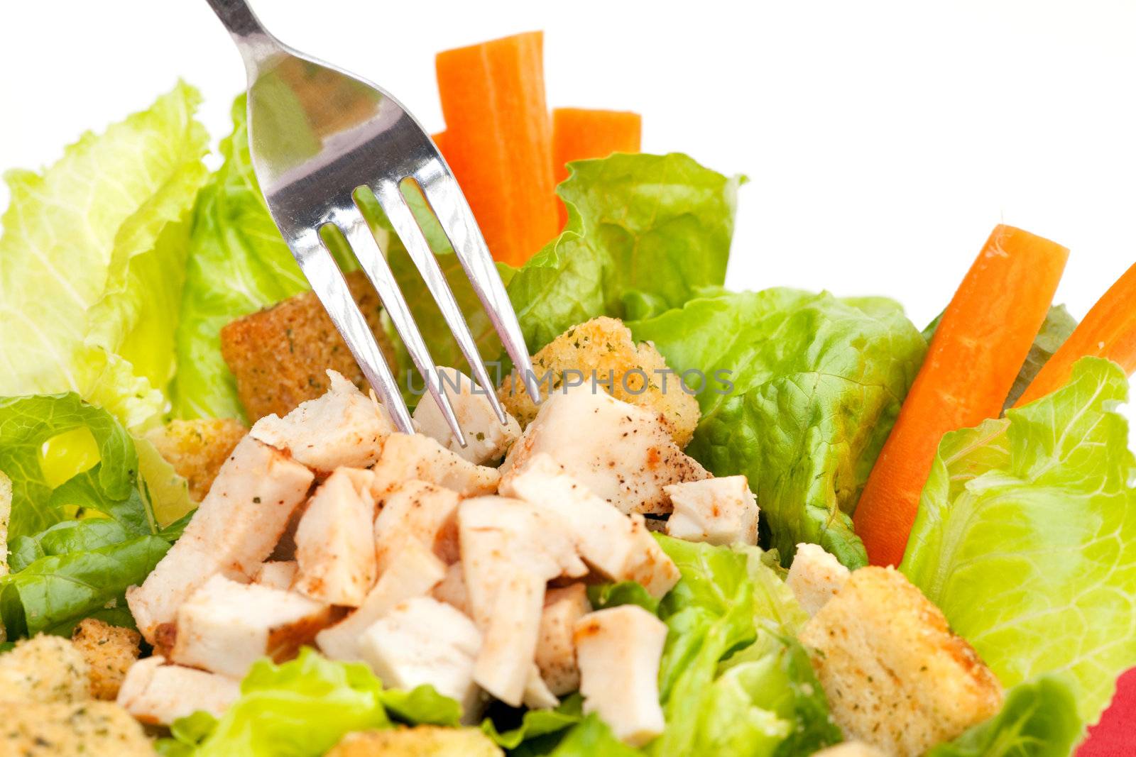Chicken Caesar Salad detail with carrots and croutons