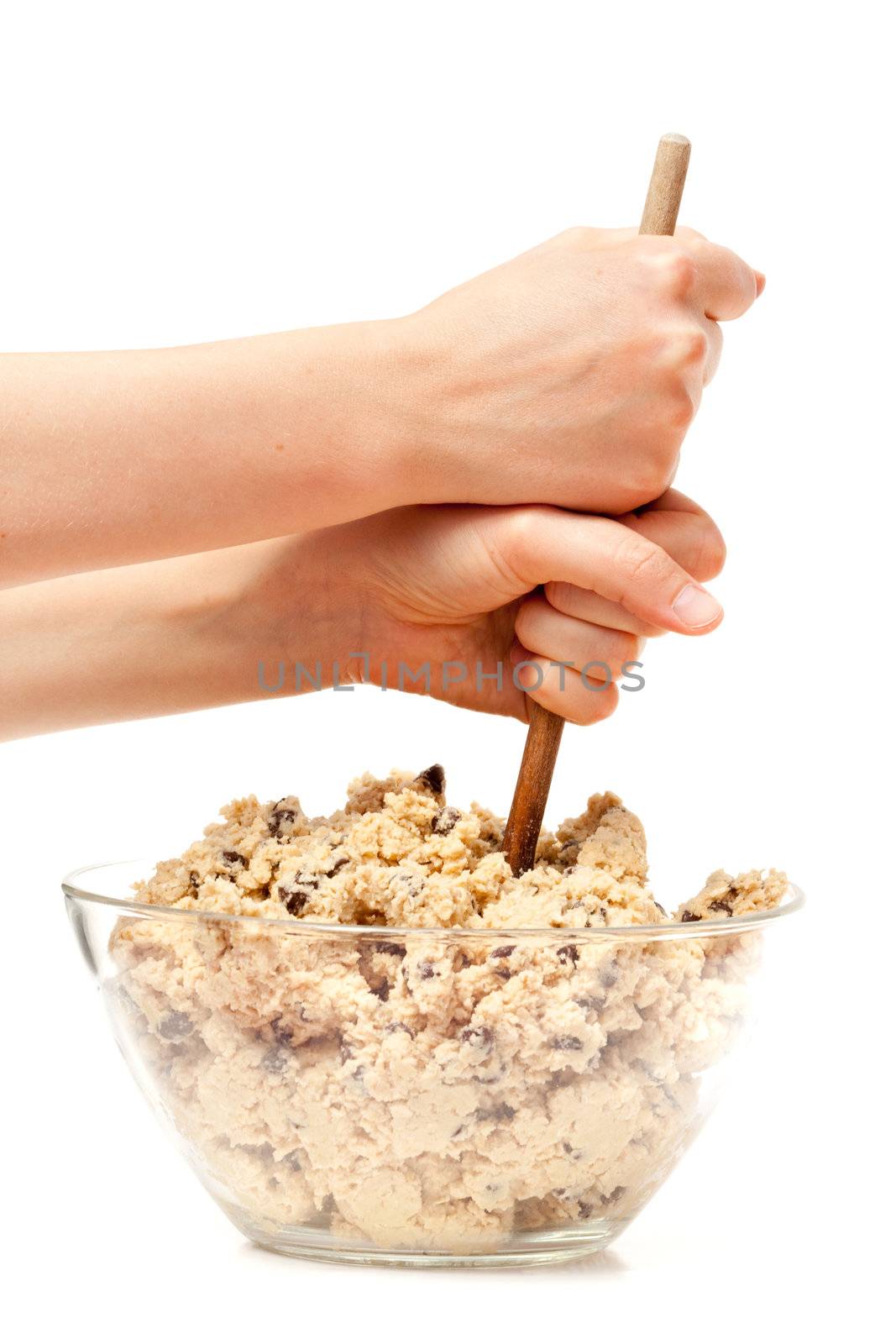 mixing a large bowl of chocolate chip cookie dough