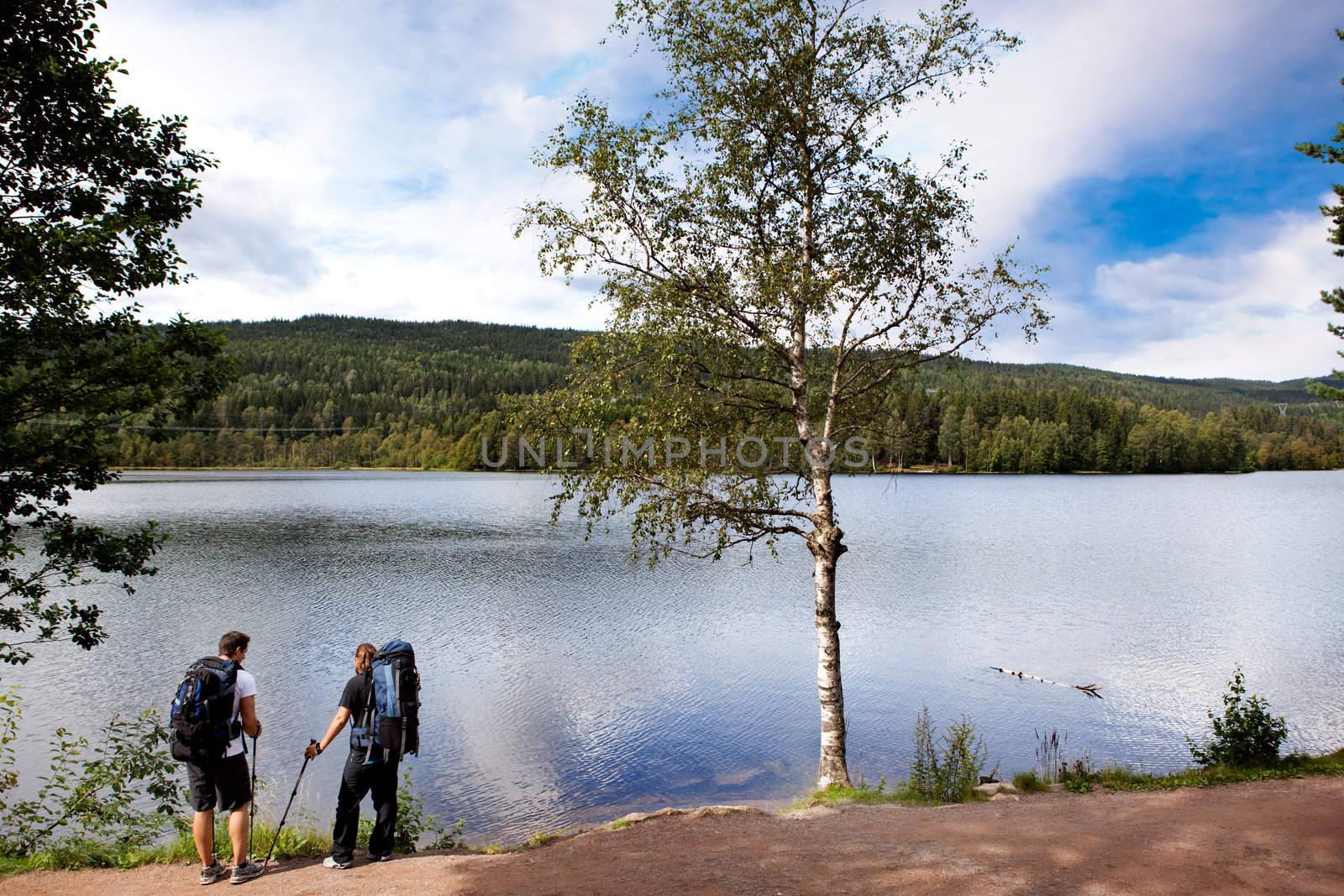 Walking and resting on a camping trip by a lake