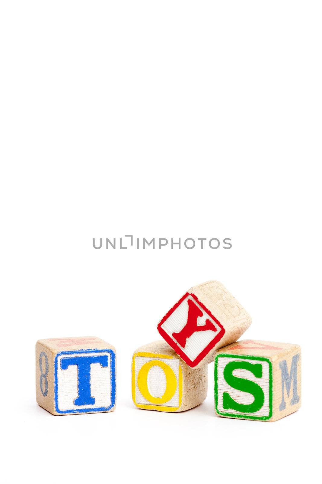 Toy blocks isolated on white spelling the word toys