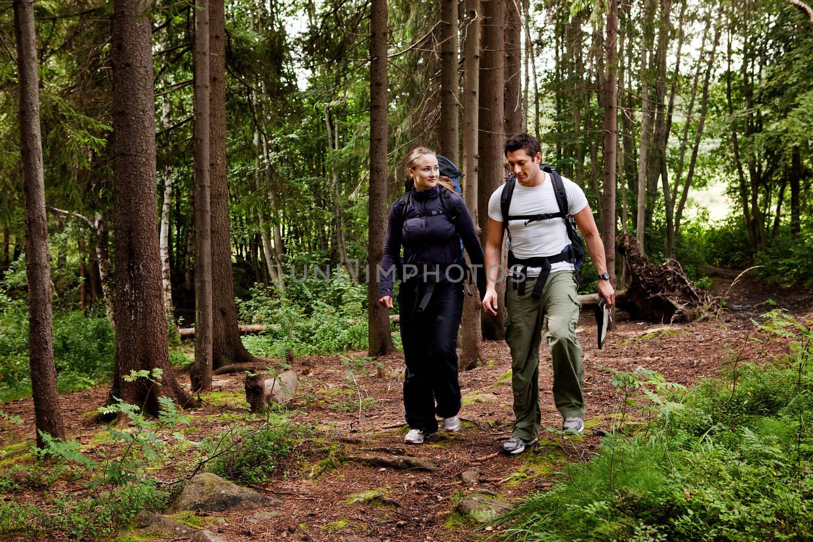 A couple on a hiking camping trip in the forest