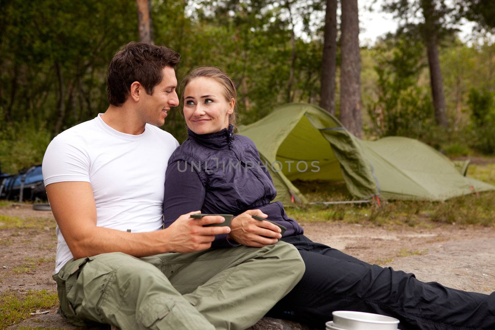 A happy couple outdoors on a camping trip