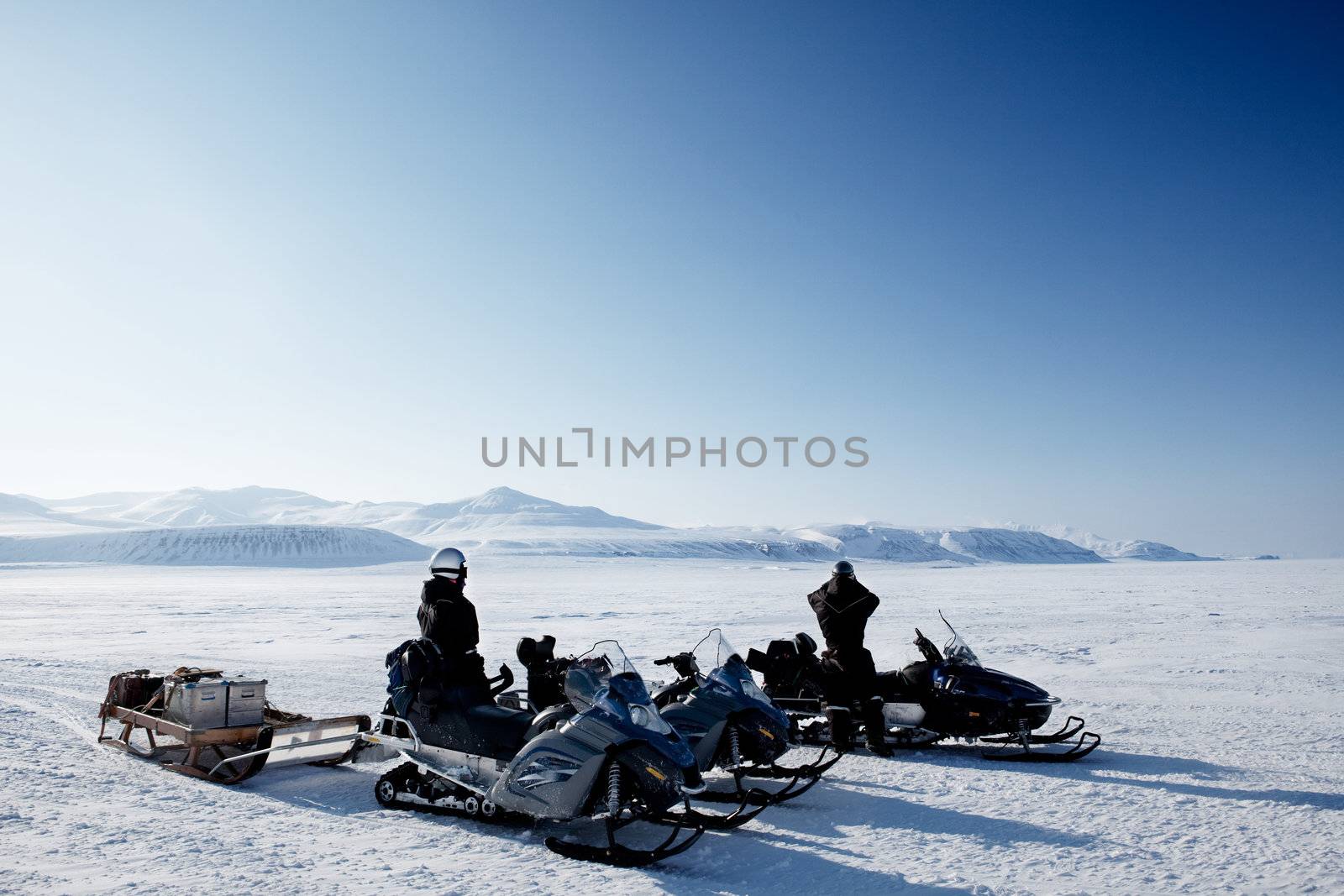 An expedition over a polar winter landscape with frozen ice