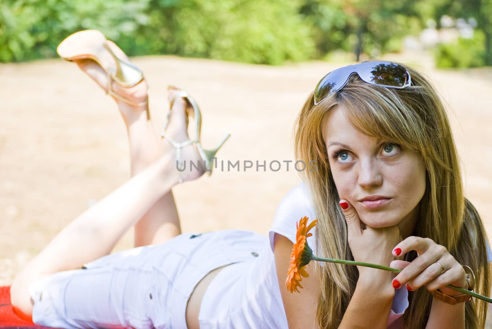 beautiful young blonde woman with flower