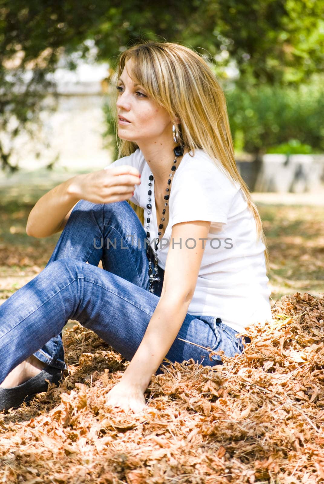 beautiful young woman throwing leaves by Dessie_bg