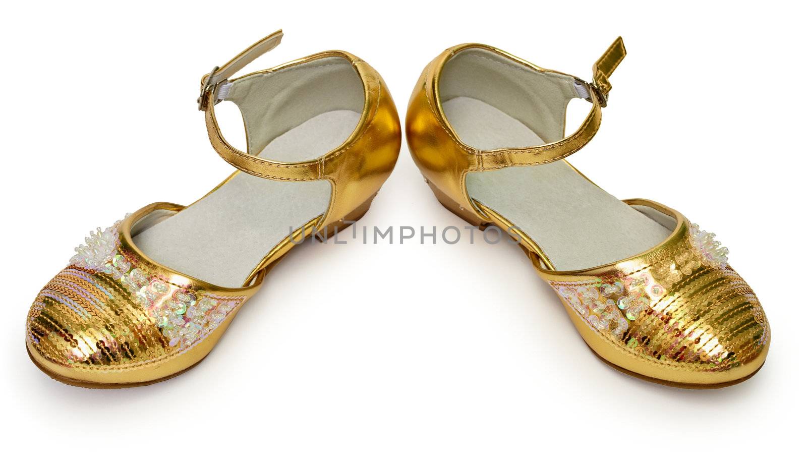 Elegant golden shoes for girls isolated on white background
