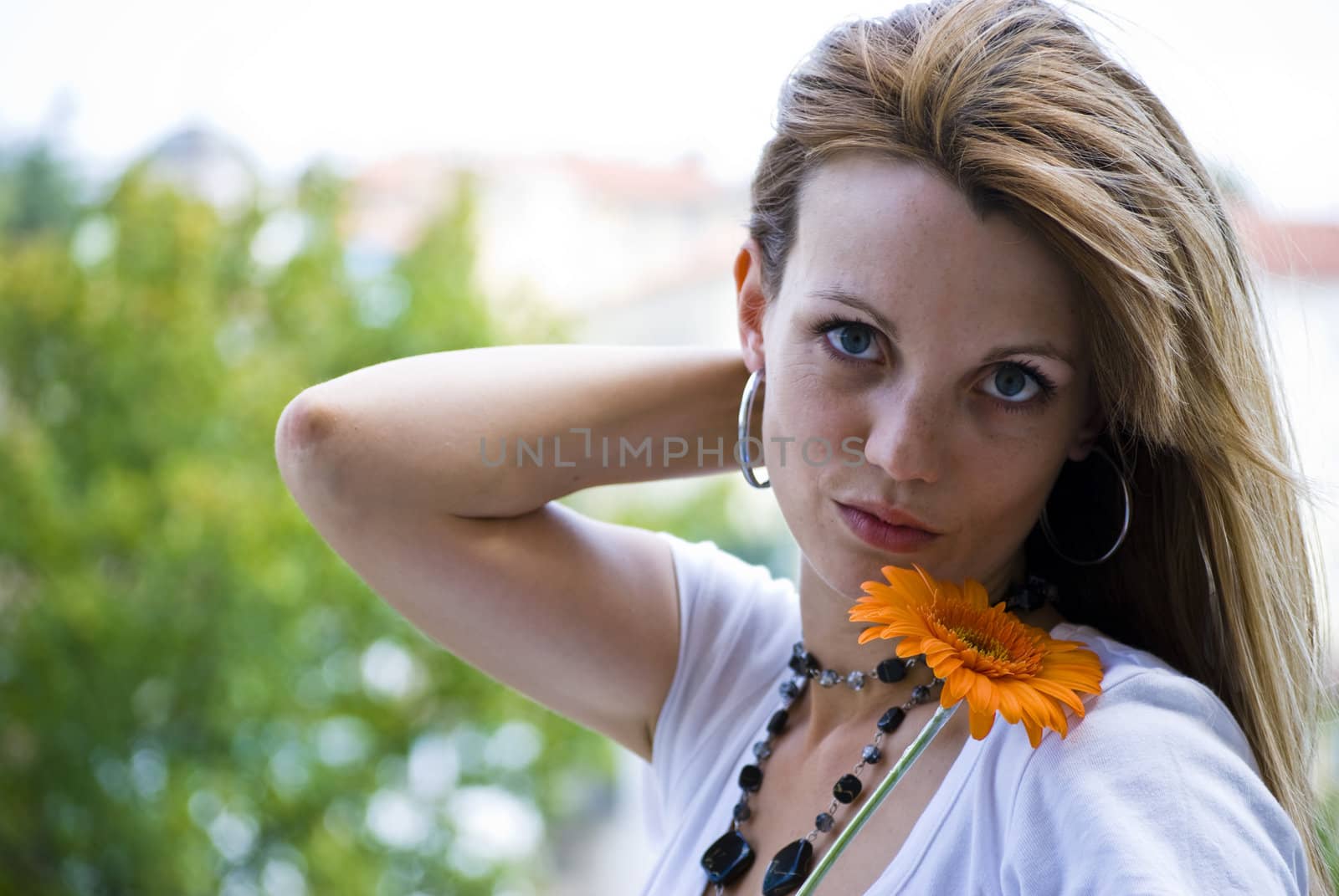 beautiful young blonde woman with flower