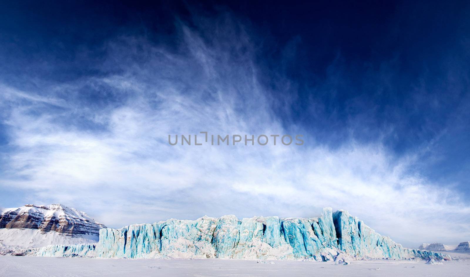 A dramatic panorama of a glacier on Spitsbergen Island, Svalbard, Norway
