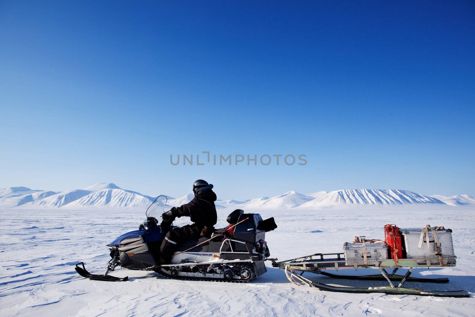 A snowmobile on an arctic expedition on a frozen lake